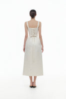 Ivory floral bustier midi dress by Montsand featuring a fitted bodice and flowing skirt, perfect for elegant occasions.