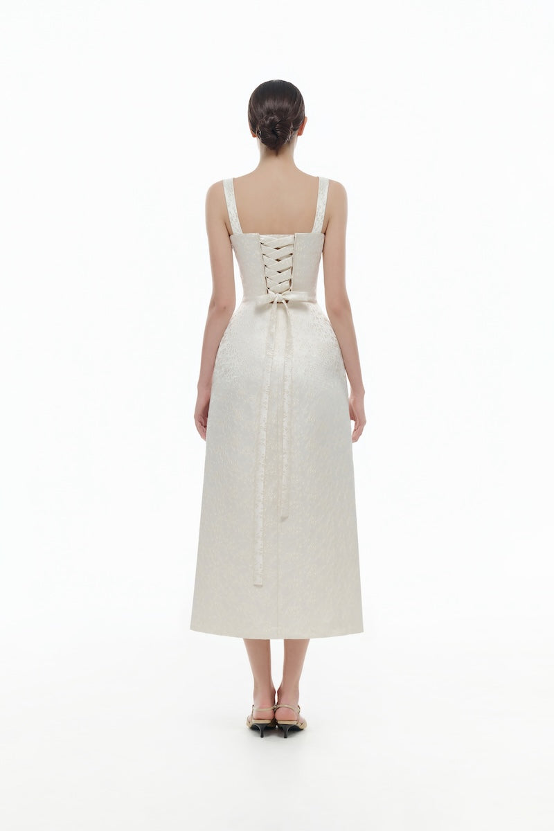 Ivory floral bustier midi dress by Montsand featuring a fitted bodice and flowing skirt, perfect for elegant occasions.