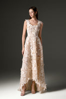 Ivory floral lace A-line gown by I.H.F Studio with pearl cluster embellishments and a trapeze midi mullet hem.