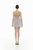 Ivory Montsand mini dress with floral design, sleeveless style, and fitted waist, perfect for summer or casual occasions.