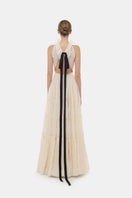 Ivory tiered halter gown by Montsand, flowing maxi dress with layered skirt and halter neckline, elegant evening wear.