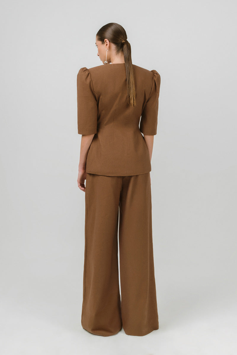 Brown Izakova BURA blazer with tailored fit, featuring notch lapels and stylish design, perfect for professional or casual wear.