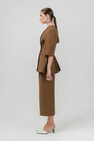 Brown NEDA midi skirt by Izakova, featuring a flowy design and midi length, shown on a model.
