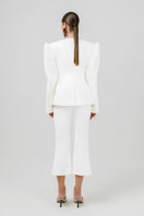 Off-white Azera blazer by Izakova, tailored fit with lapels and button closure, styled for a sophisticated look.