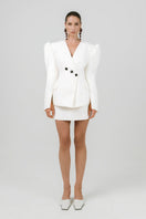 Off-white Izakova Atena mini skirt displayed on a model, showcasing a stylish, fitted design perfect for casual or dressy occasions.