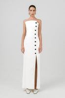Off-white Izakova DARIANA maxi dress displayed with flowing fabric and elegant design, perfect for stylish summer occasions.