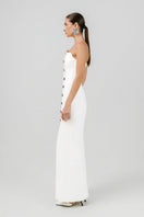 Off-white Izakova Dariana maxi dress with flowing fabric and elegant design, perfect for stylish summer wear.