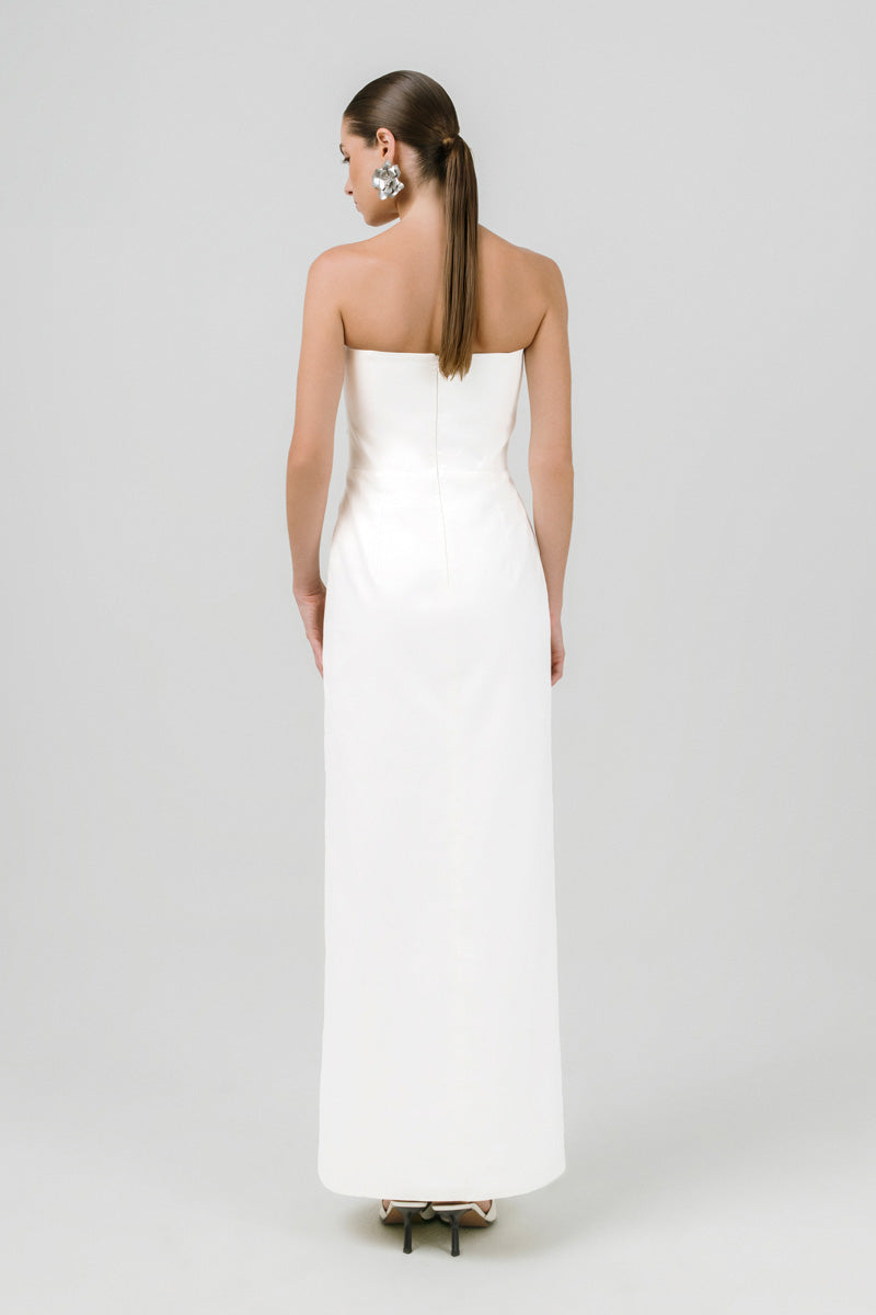 Off-white Izakova Dariana maxi dress with flowing fabric and elegant design, perfect for summer or special occasions.