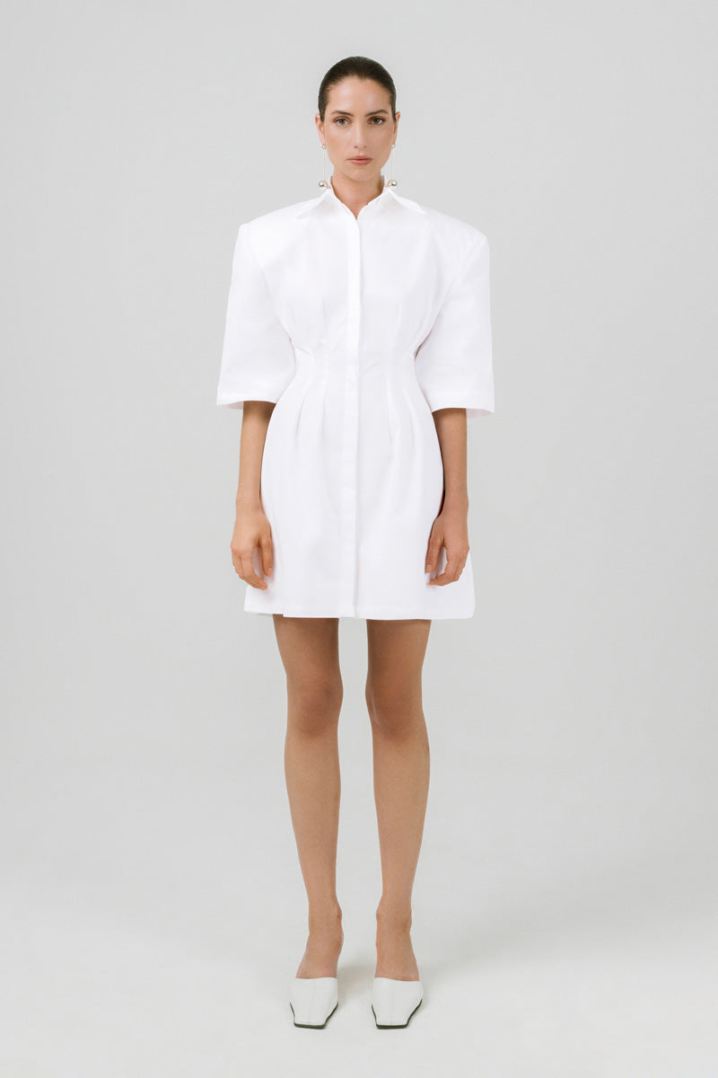 Off-white Izakova Franka shirt dress, mini length with button details and collar, styled casually on a model.