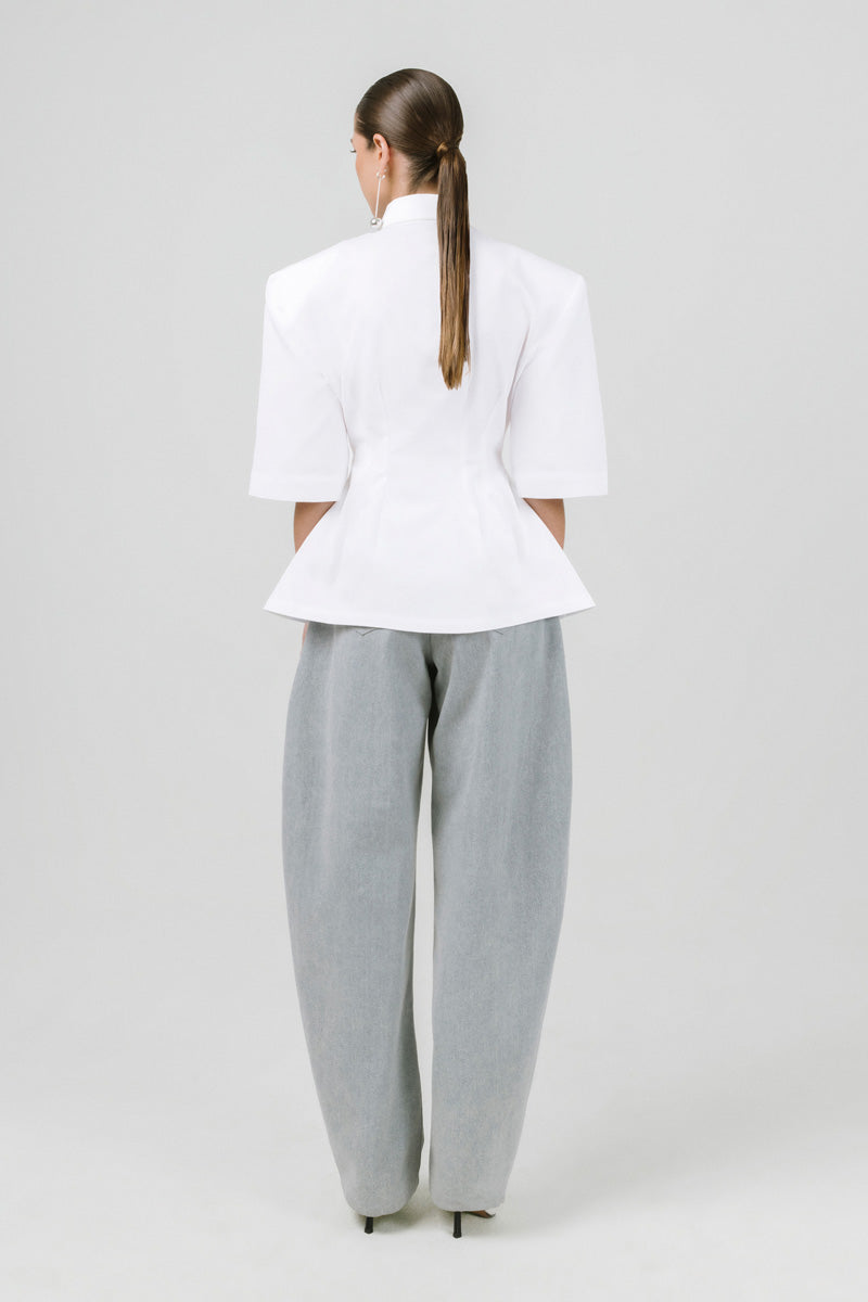 Light off-white Izakova EDISA shirt displayed on a hanger, showcasing a stylish, casual shirt with a crisp collar and long sleeves.