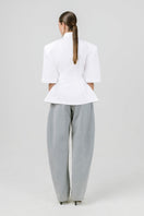 Off-white Izakova EDISA shirt displayed on a hanger, showcasing a stylish, casual shirt design with a structured collar.