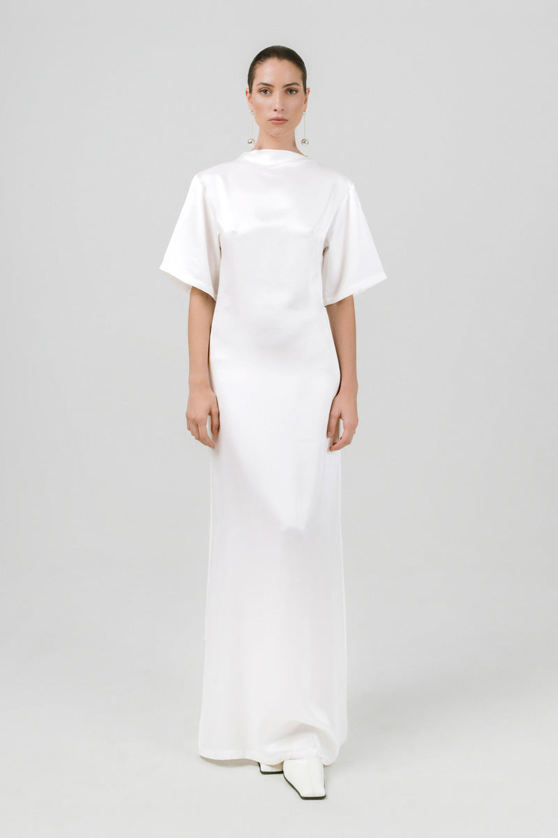 White GABRIJELA TSHIRT DRESS by Izakova, a stylish maxi dress with a relaxed fit and casual neckline, displayed on a hanger.