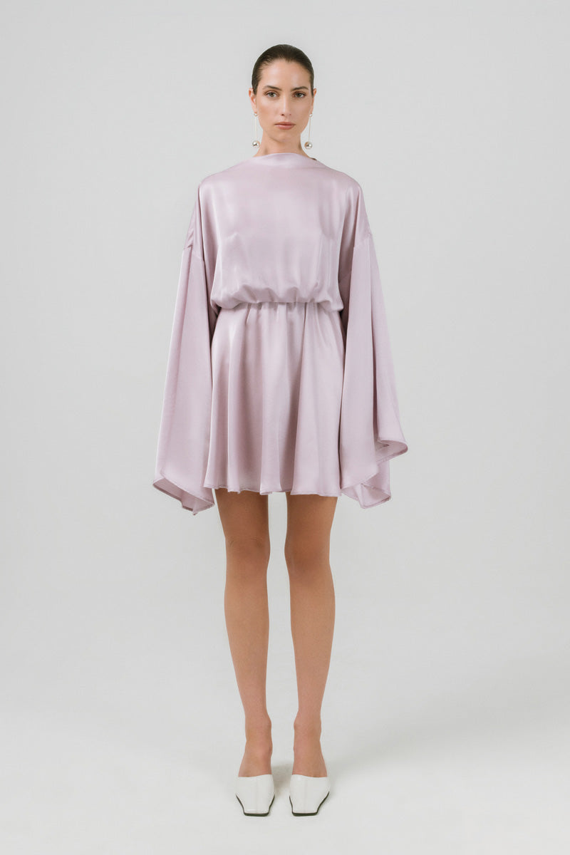 Izakova Nina lavender mini dress displayed on a hanger, showcasing its flowy fabric and stylish design.