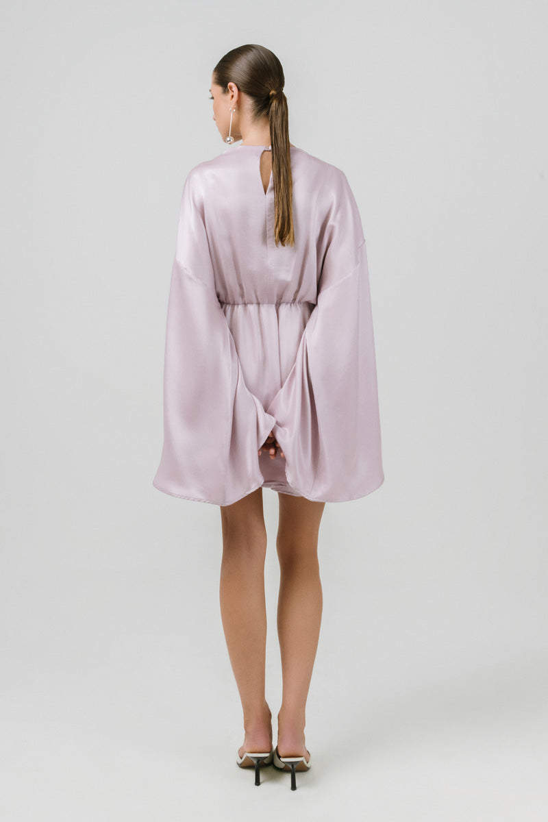 Izakova Nina lavender mini dress displayed on a hanger, showcasing its flowy fabric and stylish design.