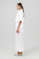 Izakova MAREA pants featuring a stylish, tailored design in a neutral fabric, displayed on a hanger against a plain background.