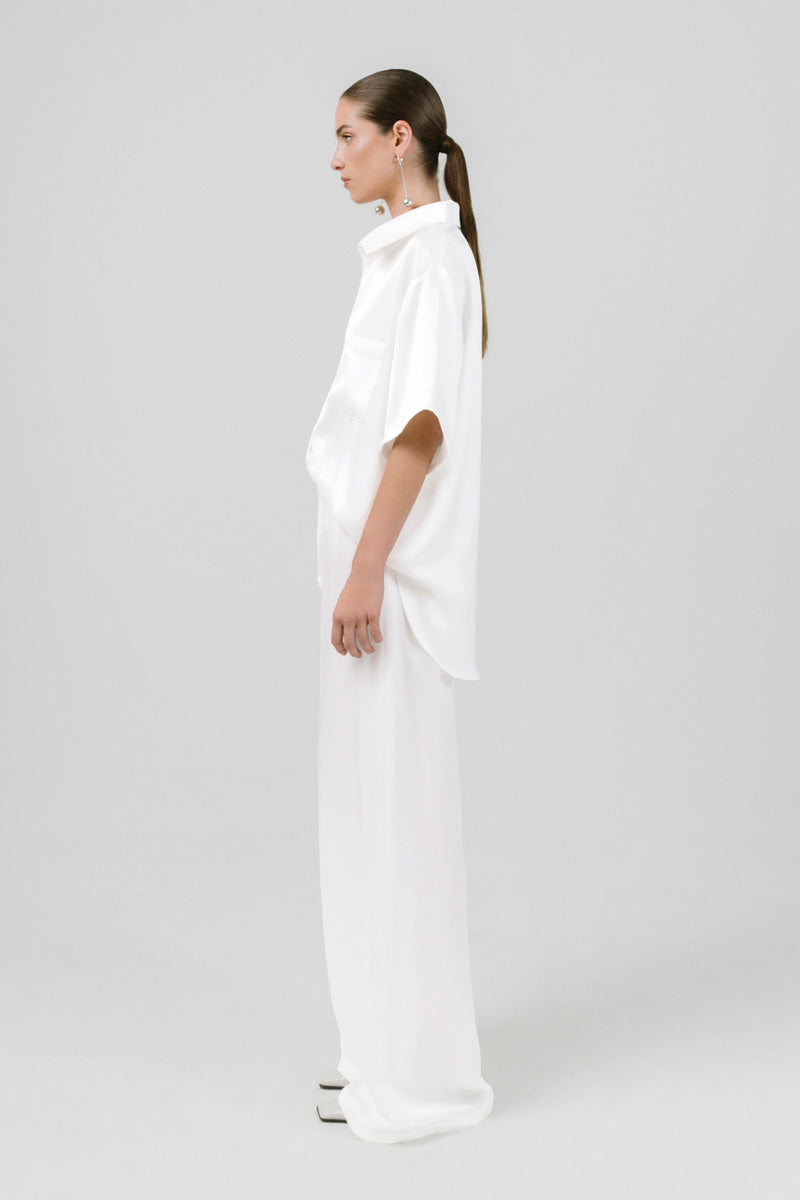 White Melanie pants by Izakova, stylish and comfortable women's pants with a clean, modern fit.