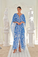 Nana Gotti Izara kaftan maxi dress featuring vibrant floral patterns and flowing fabric, perfect for elegant summer wear.