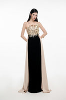 Elegant JOSÉPHINE KEIRA gown with flowing fabric and intricate details, perfect for formal occasions.