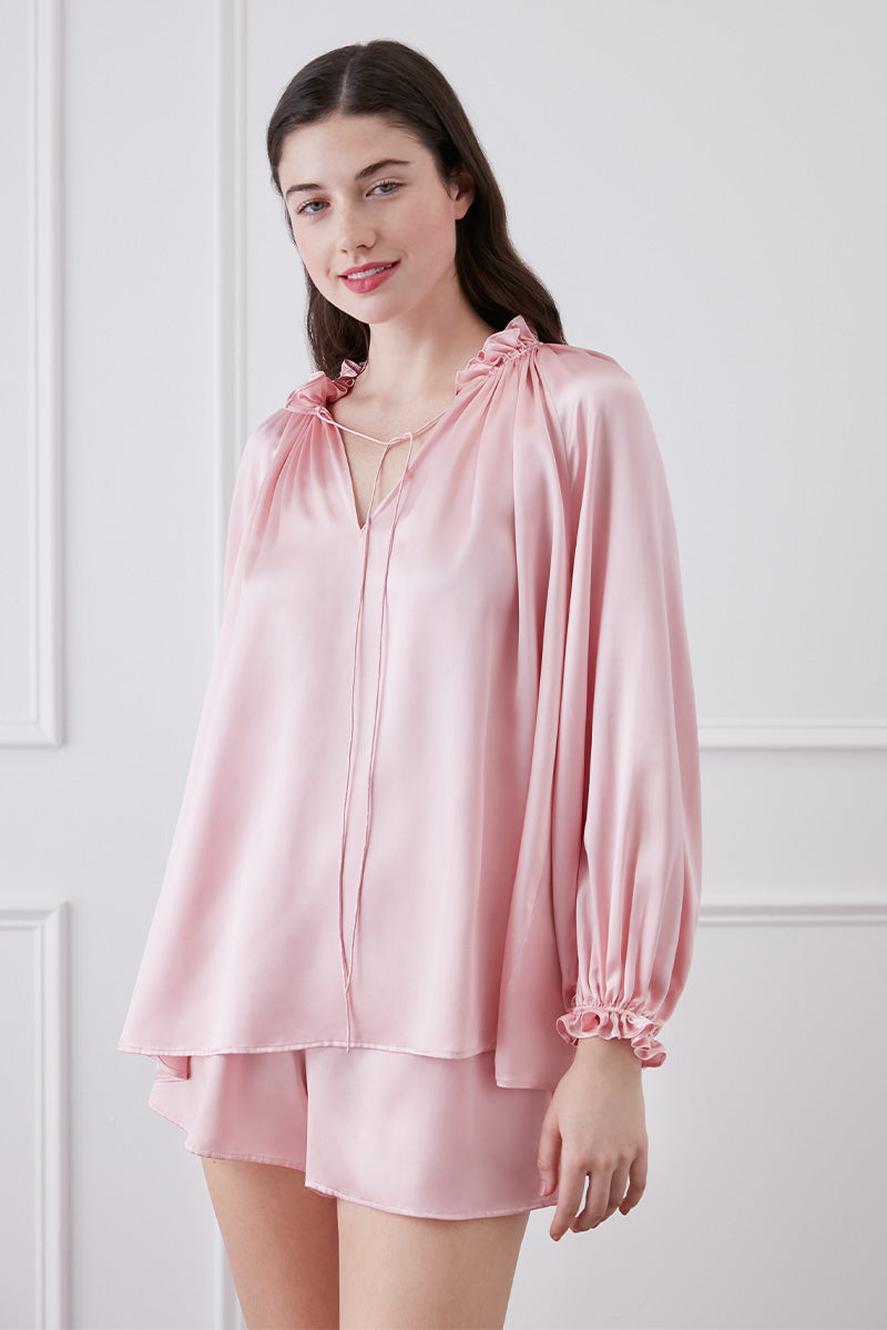 Pink Sophie ruffle-trim loungewear blouse and shorts set by MANITO, featuring soft fabric and feminine ruffle details.