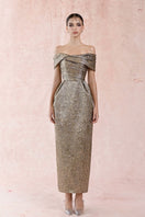 Gold jacquard pleated off-shoulder gown by HACCHIC COUTURE, featuring elegant draping and a sophisticated design.