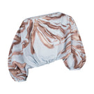 Tinta Latina Jacinta blouse in blue print, stylish long-sleeve top with a relaxed fit and vibrant floral pattern.