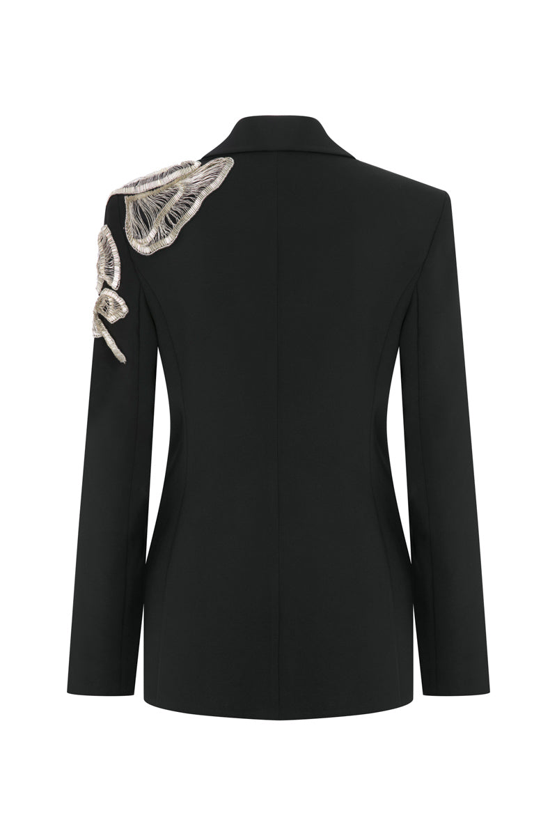 Tagg jacket with intricate hand embroidery, featuring detailed stitched patterns on the front and sleeves.