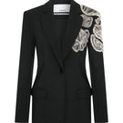 Tagg jacket with intricate hand embroidery, featuring detailed floral patterns on a stylish outerwear piece.