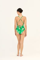 Aguaclara Jade one-piece swimsuit with a sleek, fitted design and vibrant green color, displayed on a mannequin.