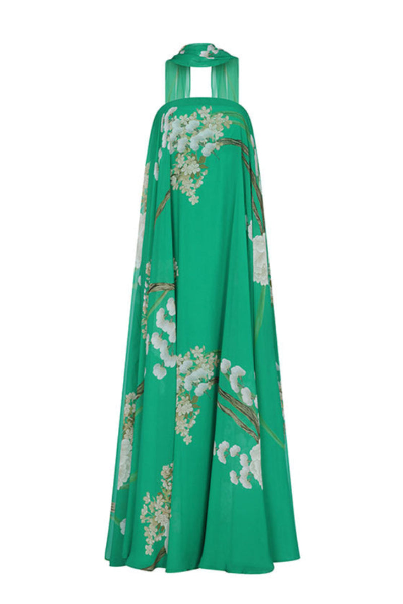 Aguaclara Jade maxi dress featuring a flowing fabric and vibrant green color, displayed on a hanger with a plain background.