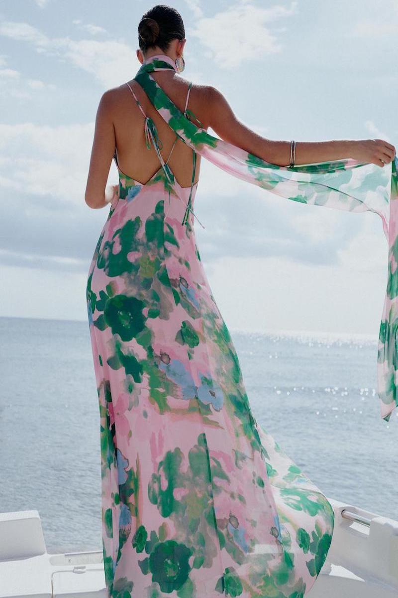 Soft pink and green maxi dress by SISTERS, featuring flowing fabric and elegant design, perfect for casual or semi-formal wear.