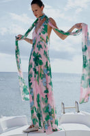 Sisters Jane maxi dress in soft pink and green with floral pattern, flowing fabric, and sleeveless design for warm weather.