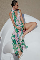 Sisters Jane maxi dress in soft pink and green floral print, flowing fabric, sleeveless design, perfect for summer wear.