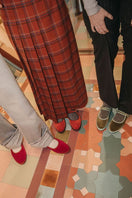 Flabelus Jay green flats with light green piping, stylish slip-on shoes shown from a side angle.