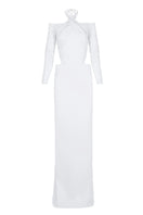 Embroidered tulle gown by JC Pajares featuring delicate embroidery and flowing fabric, perfect for special occasions.