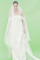Elegant strapless satin maxi dress by JC Pajares, featuring a smooth, flowing silhouette perfect for formal occasions.