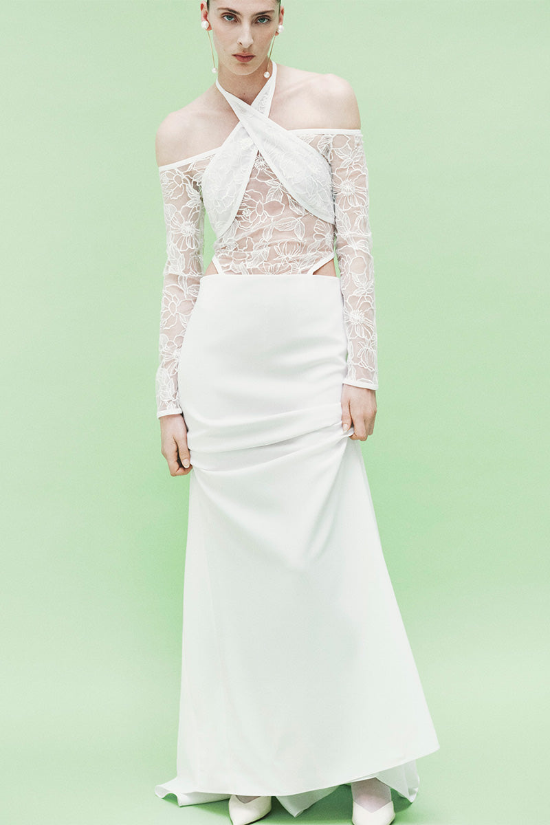 Embroidered tulle maxi dress by JC Pajares featuring intricate embroidery and flowing fabric, perfect for elegant occasions.
