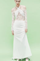 Elegant embroidered tulle gown by JC Pajares featuring delicate embroidery and flowing fabric, ideal for special occasions.