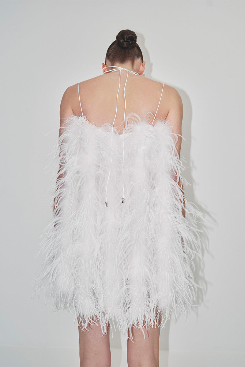 Mini feather dress from JC Pajares, stylish bridal look with delicate feather details, perfect for special occasions or weddings.