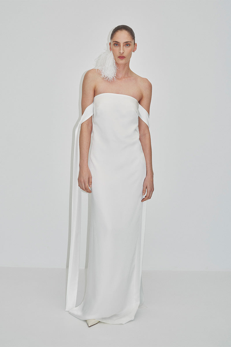 Elegant strapless satin maxi dress by JC Pajares, featuring a flowing silhouette and smooth satin fabric.