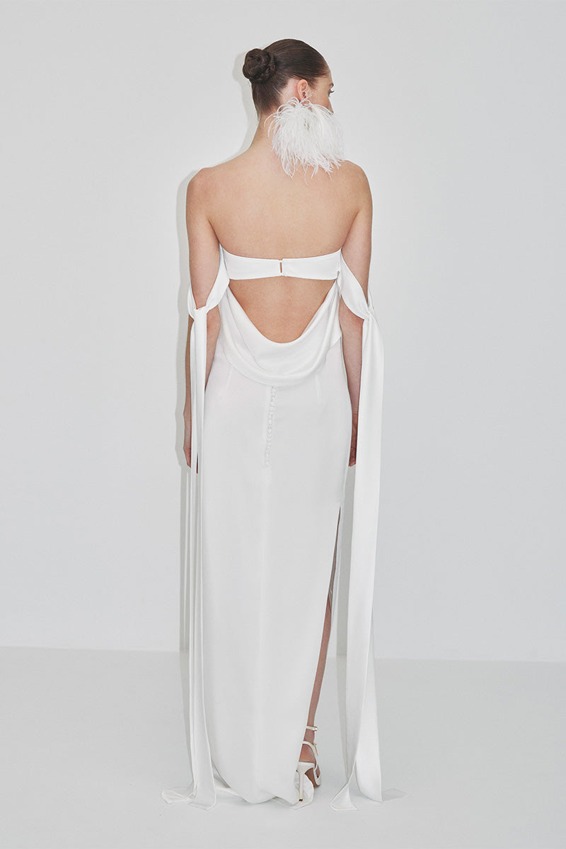 Elegant strapless satin maxi dress by JC Pajares, featuring a flowing silhouette and smooth fabric, perfect for formal occasions.