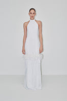 Elegant maxi dress with a halter-neck and feather details by JC Pajares, perfect for a sophisticated bridal or evening look.