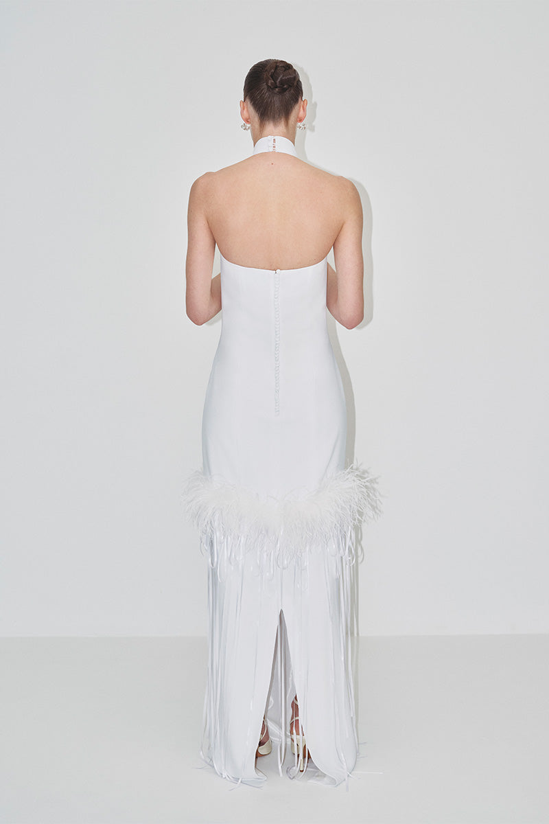 Elegant JC Pajares halter-neck maxi dress with feather details, perfect for a stylish bridal or formal occasion.