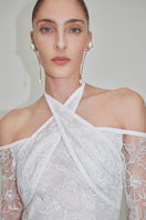 Elegant embroidered tulle dress by JC Pajares, featuring intricate embroidery and a flowing gown design.