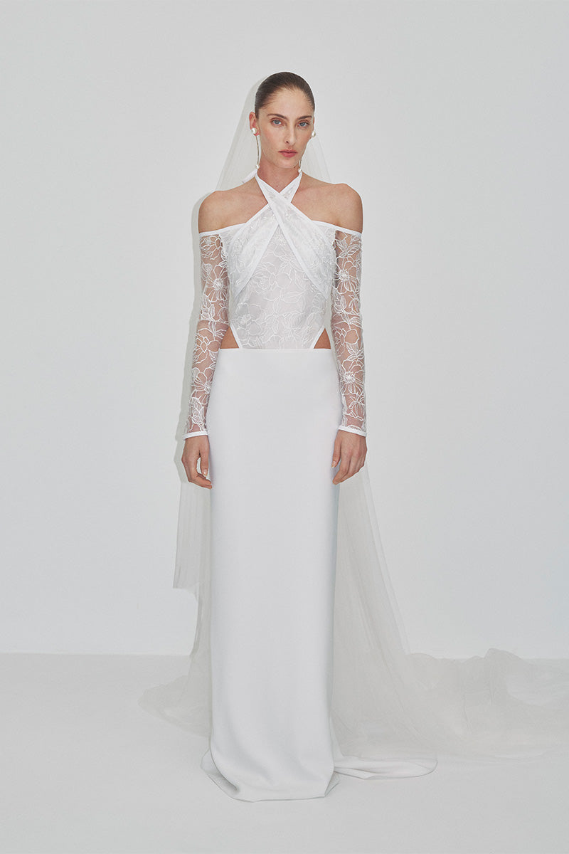 Embroidered tulle maxi dress by JC Pajares featuring delicate embroidery and a flowing silhouette for elegant occasions.