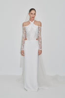 Embroidered tulle gown by JC Pajares featuring intricate embroidery and flowing fabric, perfect for a bridal or formal look.