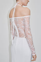Embroidered tulle gown by JC Pajares featuring intricate embroidery and flowing fabric, perfect for elegant occasions.