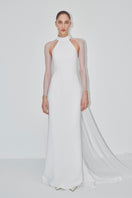 Elegant double crepe gown with tulle sleeves by JC Pajares, showcased in a bridal lookbook image.