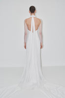 Elegant JC Pajares double crepe gown with tulle sleeves, featuring a flowing silhouette and delicate detailing for special occasions.