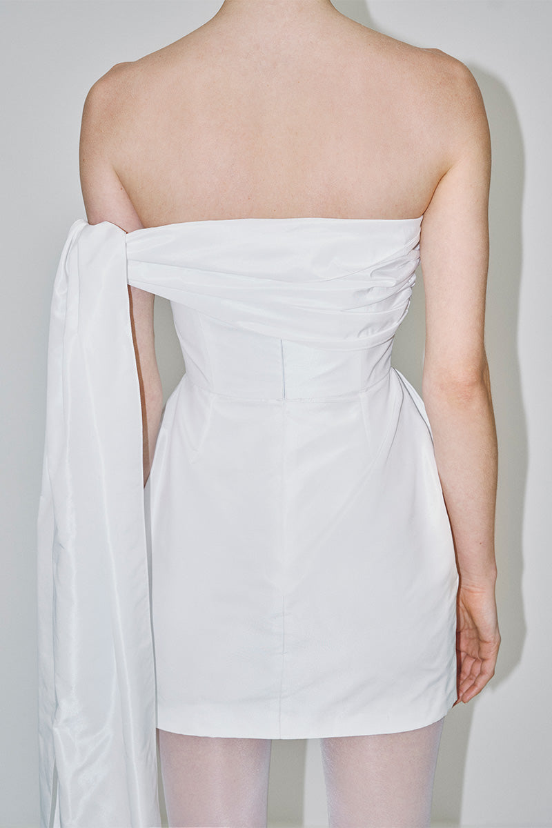 White tulip dress in double taffeta by JC Pajares, featuring a mini length and elegant bridal-inspired design.