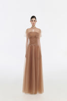 Elegant navy SERENA gown by JOSÉPHINE with flowing fabric and intricate detailing, perfect for formal occasions.